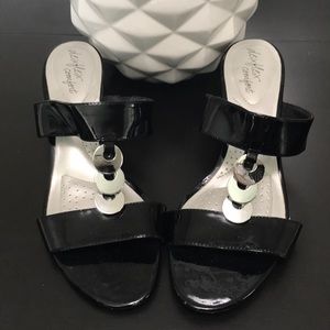 Black wedge sandals with metal circle detail